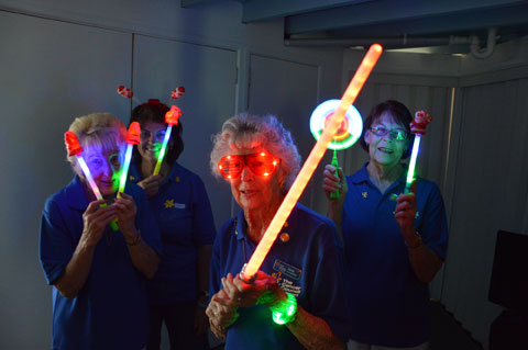 CancerFree volunteers Dell Boyd, Cr Wendy Boglary, June Craven and Del Roeton get set to light up the Redlands with glow products for Christmas by Starlight on December 7.